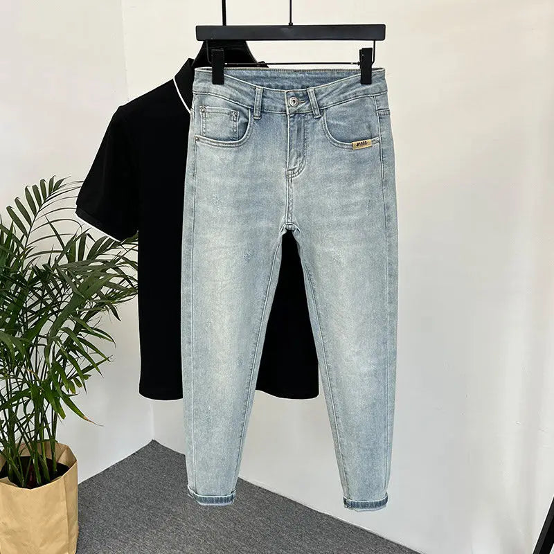 Lifestyle shot of light blue skinny jeans with distressed details.