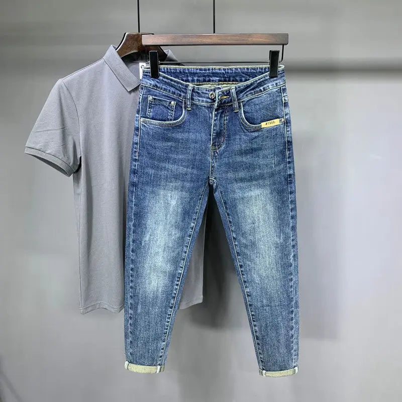 Lifestyle shot of light blue jeans displayed with a casual outfit.