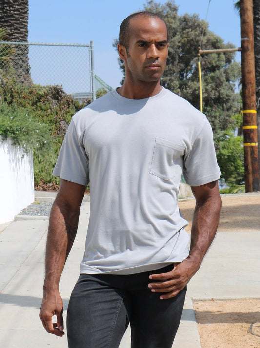 Man in gray bamboo viscose t-shirt with short sleeves, lifestyle shot.
