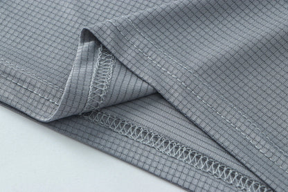 Detail shot of gray fabric with a folded edge and soft texture.