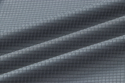 Detail of gray fabric with a smooth texture.