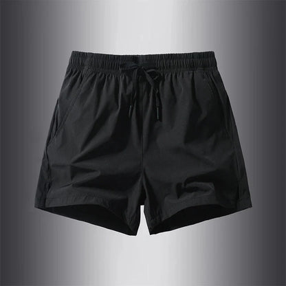 Front view of black running shorts featuring an elastic waistband.