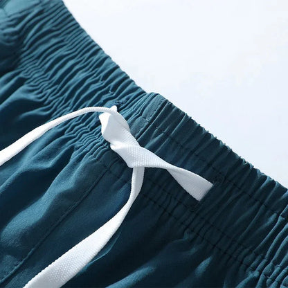 Close-up detail of smooth fabric texture in blue running shorts.