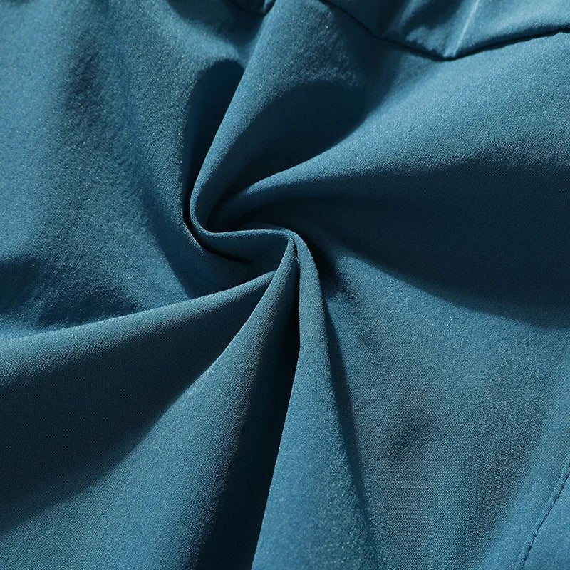 Close-up detail of waistband showing elastic and drawstring features.