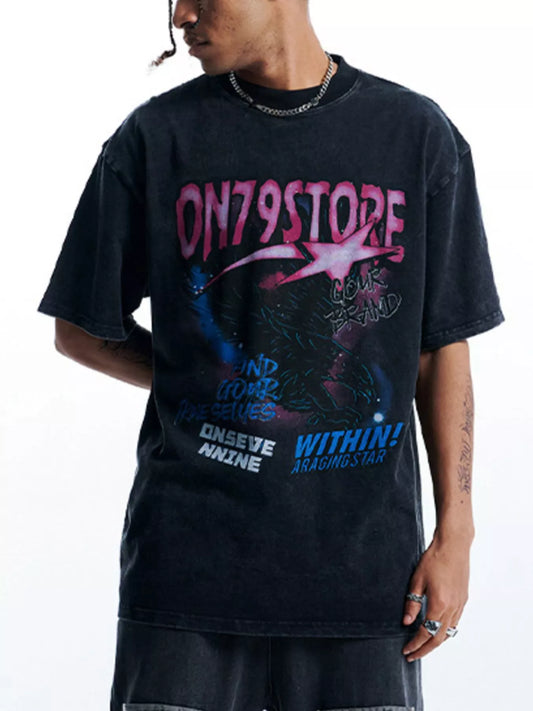 Front view of the oversized graphic t-shirt in black with pink and blue print.
