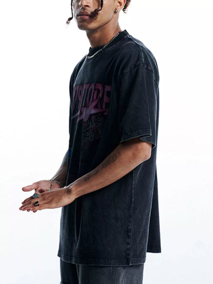 Side view of the oversized graphic t-shirt in black with pink and blue print.
