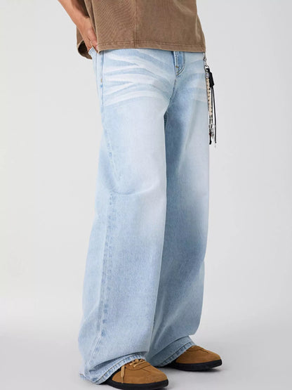 Side view of light blue wide leg jeans showcasing the faded wash.