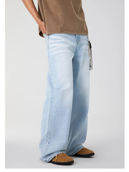 Side view of light blue wide leg jeans featuring a faded wash.