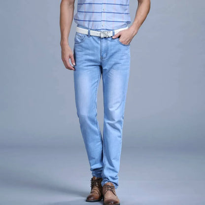 Front view of light blue slim jeans featuring a plain design.