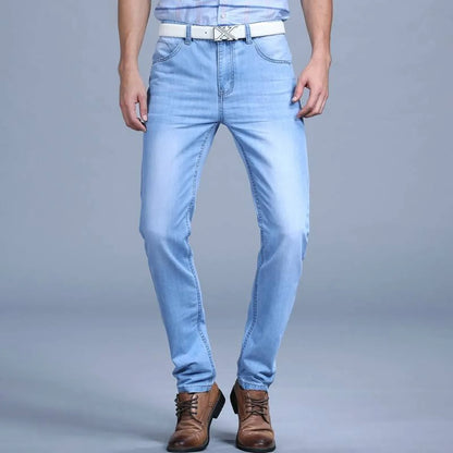Front view of blue slim jeans featuring washed denim.