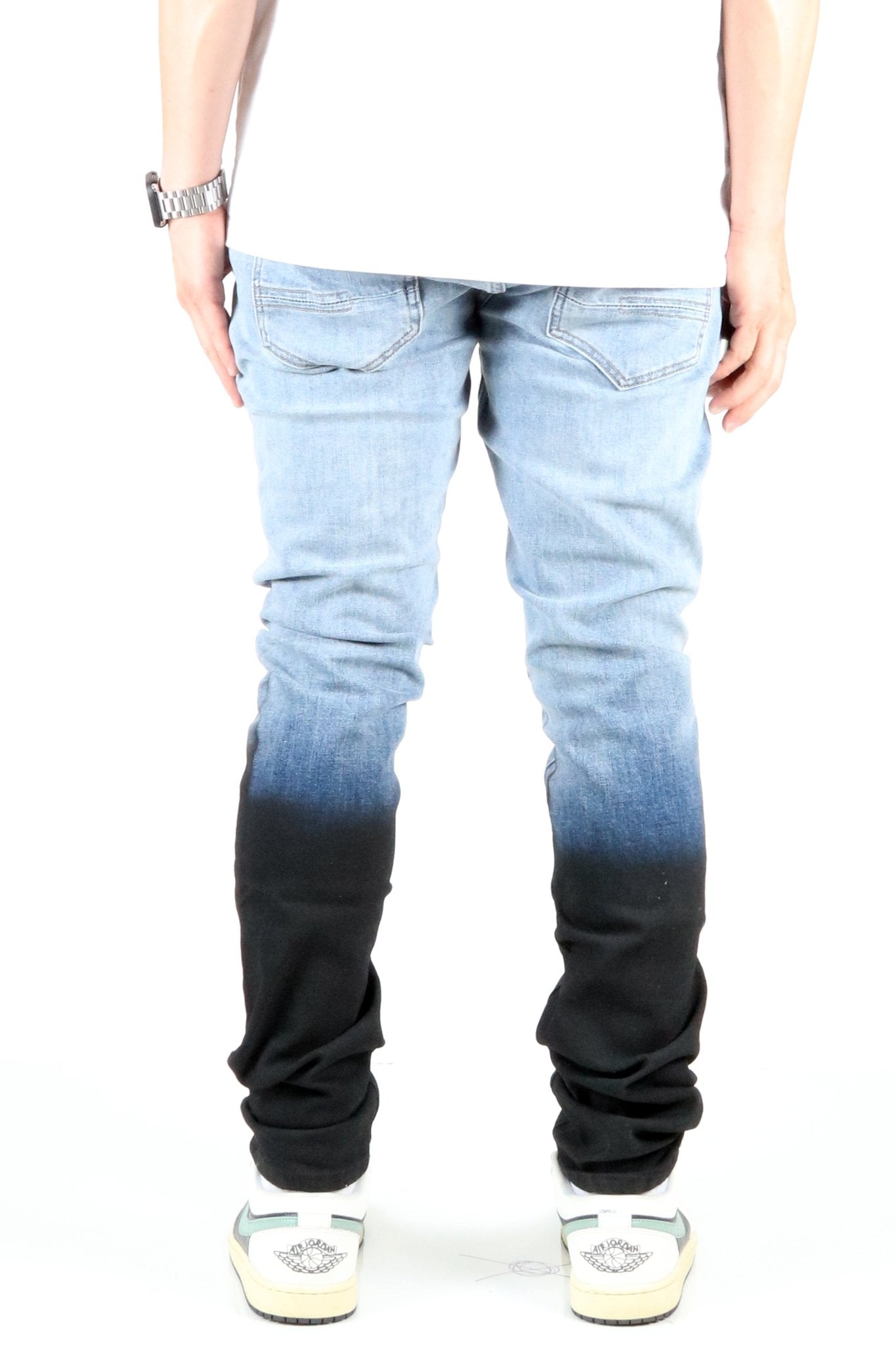 Back view of the heavy washed skinny denim pants highlighting the ombre design.