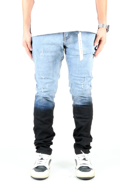 Front view of the heavy washed skinny denim pants with black dip dye effect.