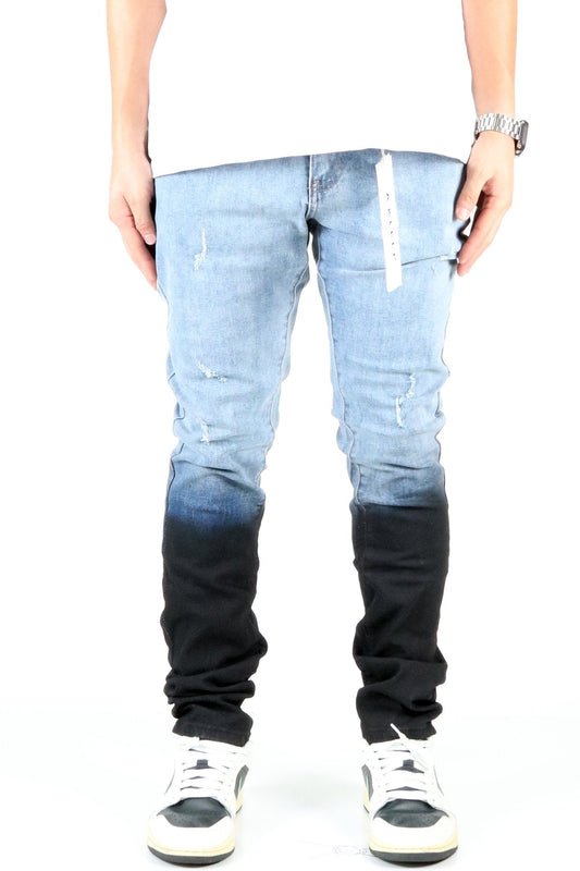 Front view of the heavy washed skinny denim pants with black dip dye effect.