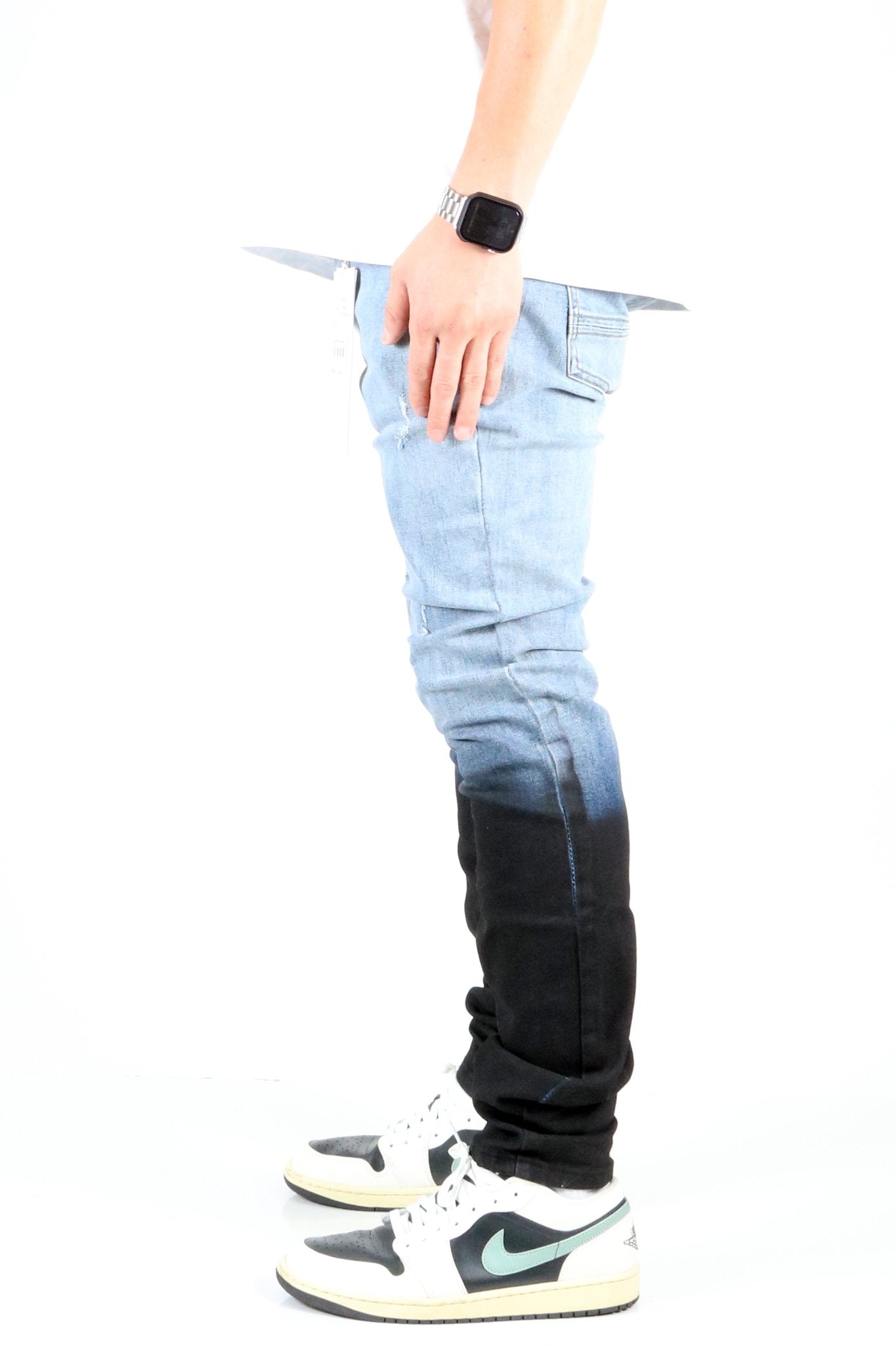 Side view of the heavy washed skinny denim pants showcasing the ombre effect.