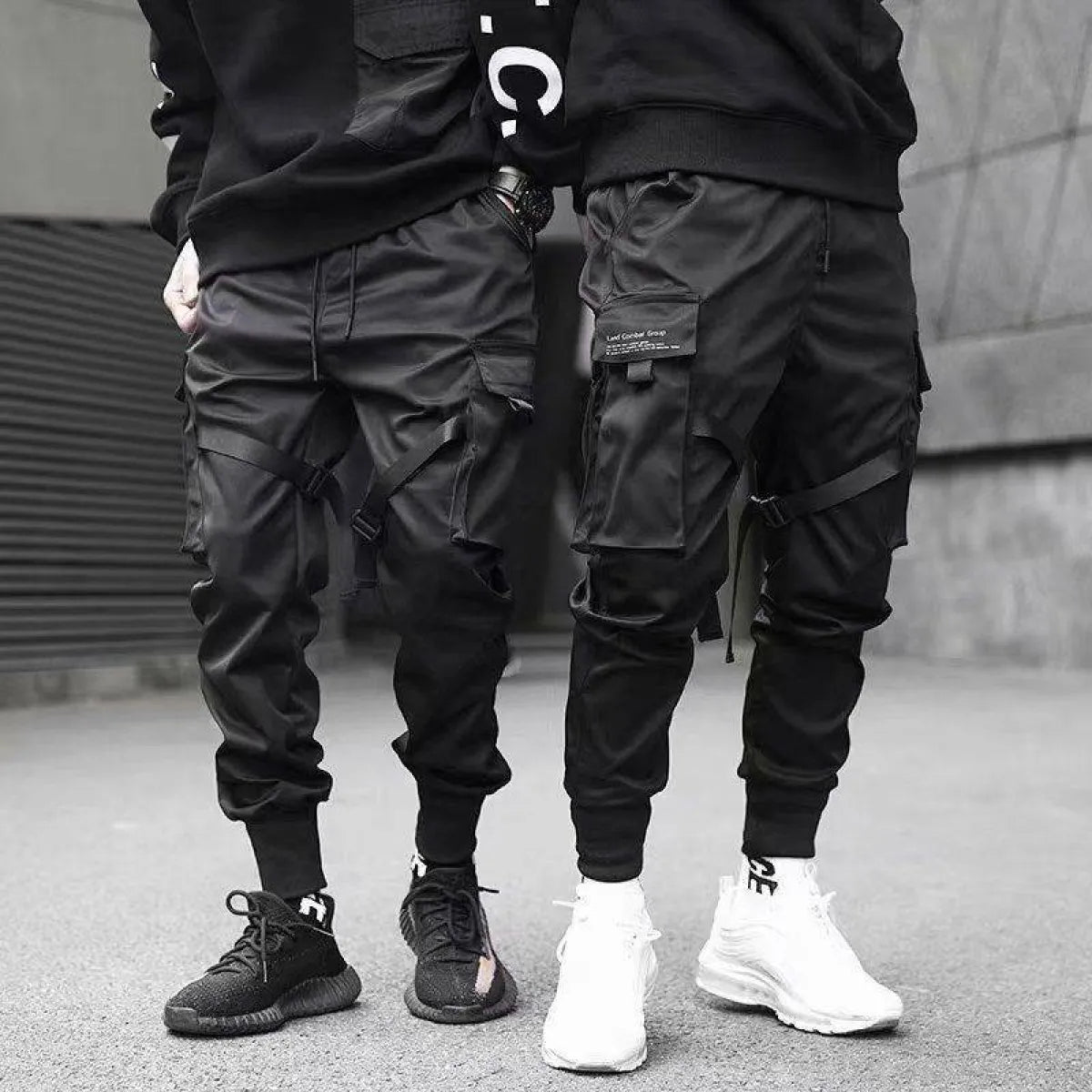 Black cargo pants with cargo pockets, lifestyle view.