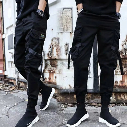 Black cargo pants with multiple pockets, side view.