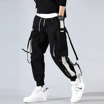Black cargo pants with cargo pockets and drawstring waist, side view.
