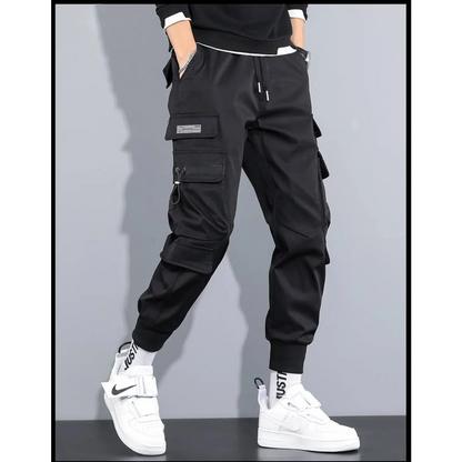 Side view of black cargo pants featuring cargo pockets and elastic cuffs.