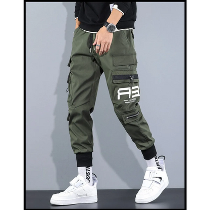 Green cargo pants with cargo pockets and patch detail, side view.