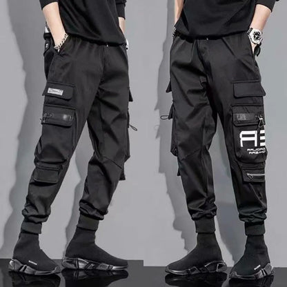 Military Techwear Pants side view with multiple pockets and elastic cuffs.