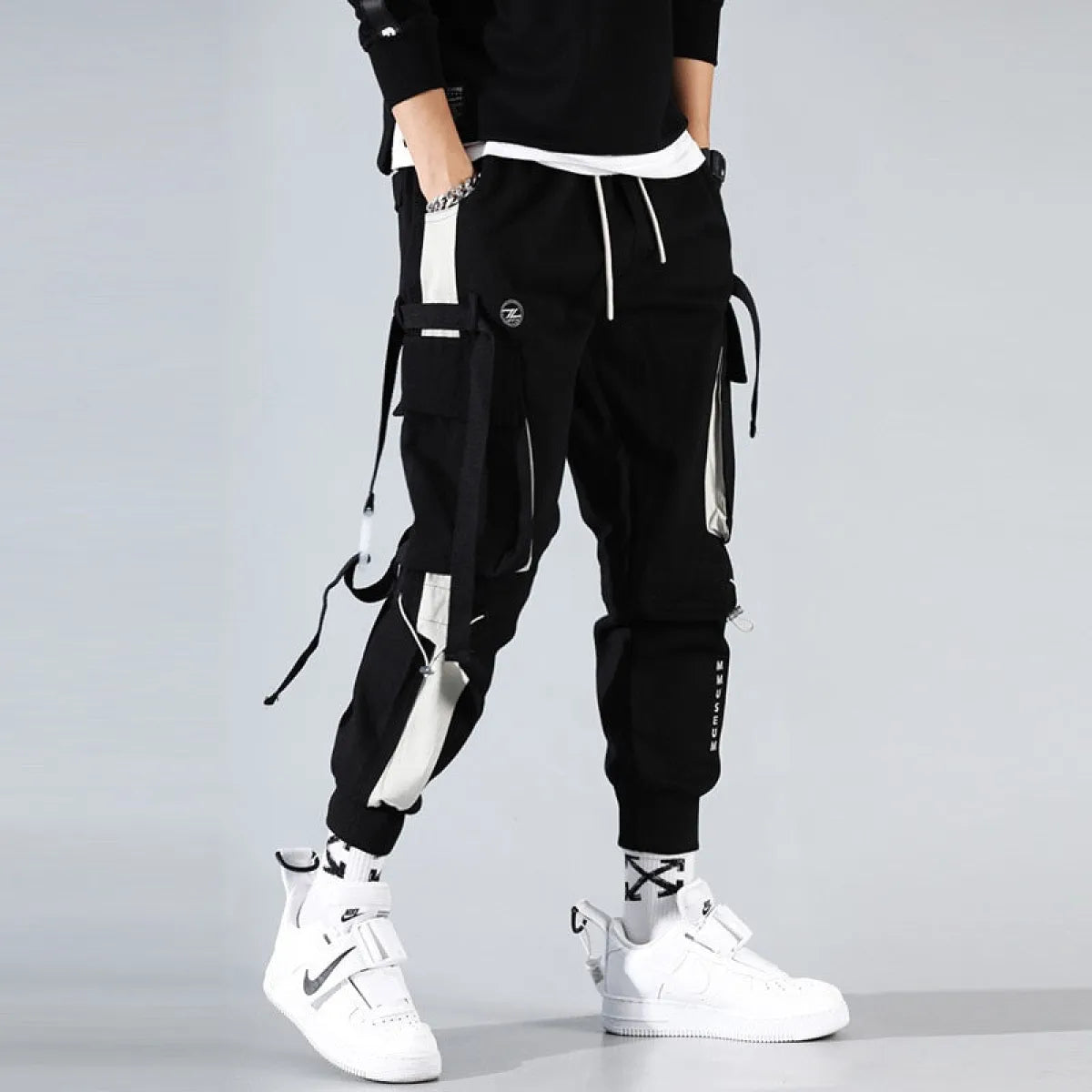 Military Techwear Pants side view with straps and multiple pockets.