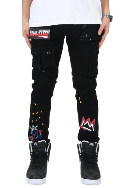 Front view of the black cargo pants featuring graphic patches.