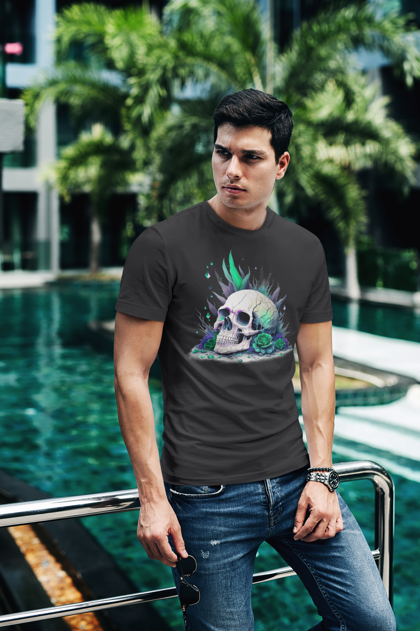 Fitted neon skull graphic tee in black and green, lifestyle shot by a pool.