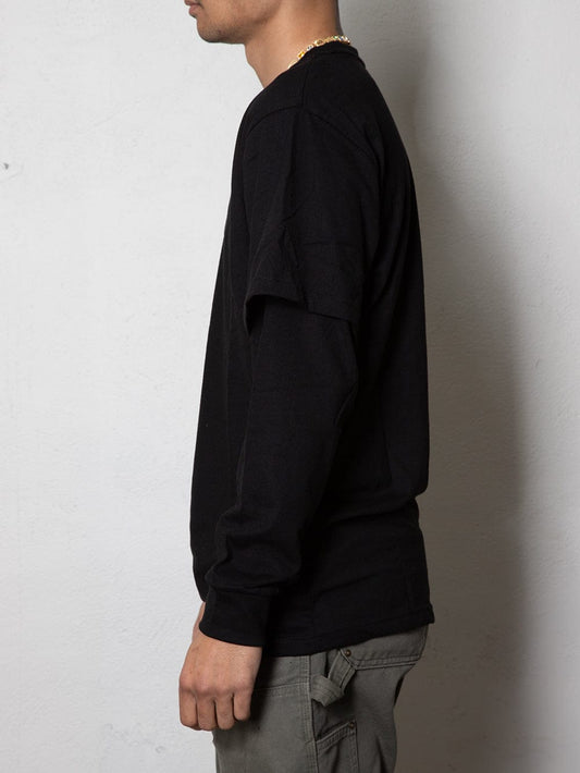 Side view of the black long sleeve t-shirt featuring long sleeves.