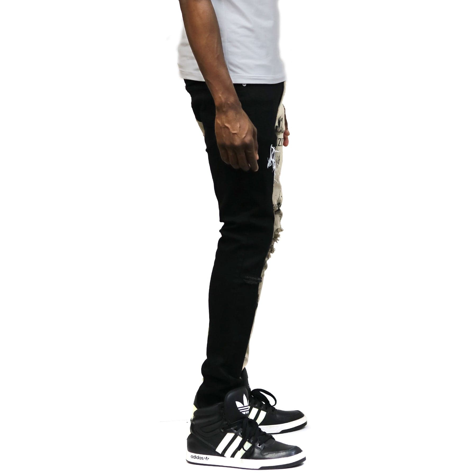 Back view of the half black and half khaki skinny twill pants.