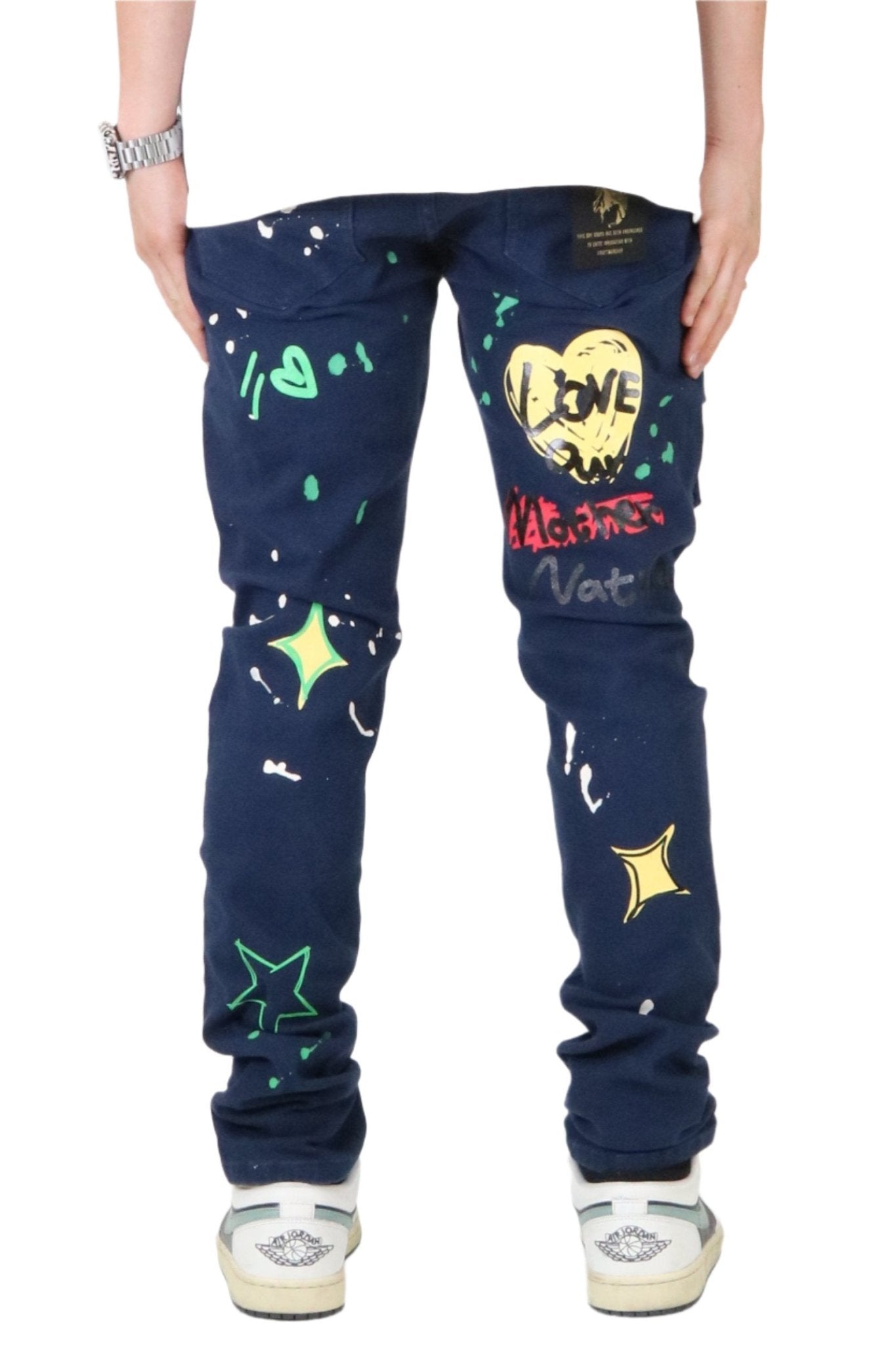 Back view of the blue skinny twill cargo pants featuring colorful patches.