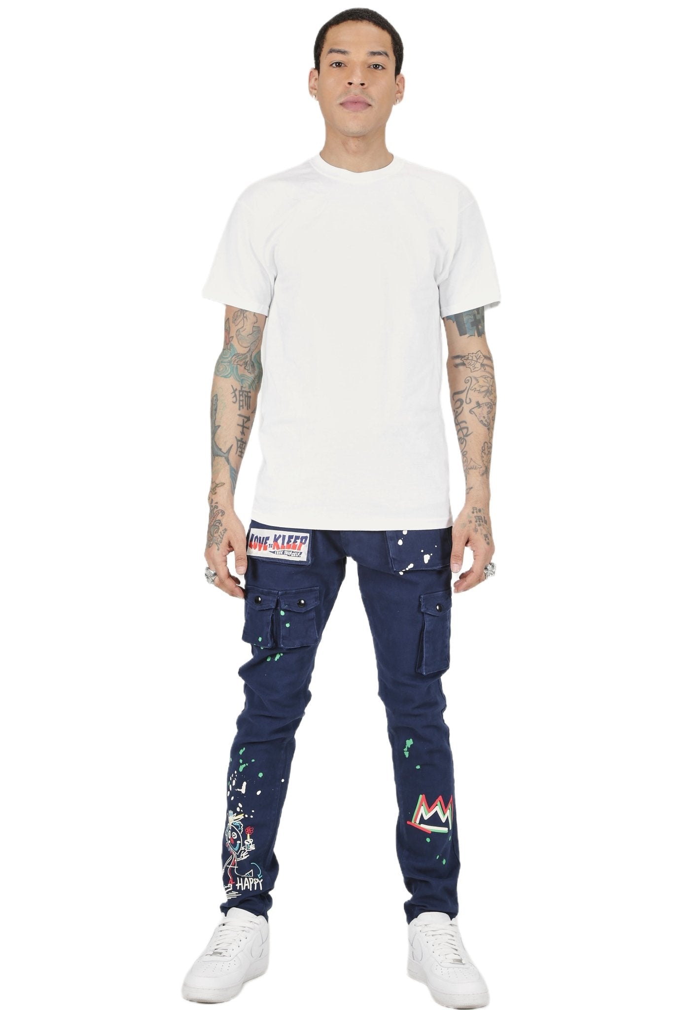 Lifestyle shot of a man wearing blue skinny twill cargo pants with a casual style.