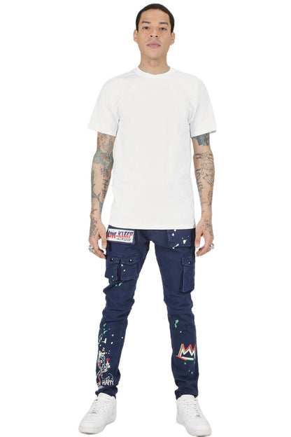 Lifestyle shot of a man wearing blue skinny twill cargo pants with a casual style.