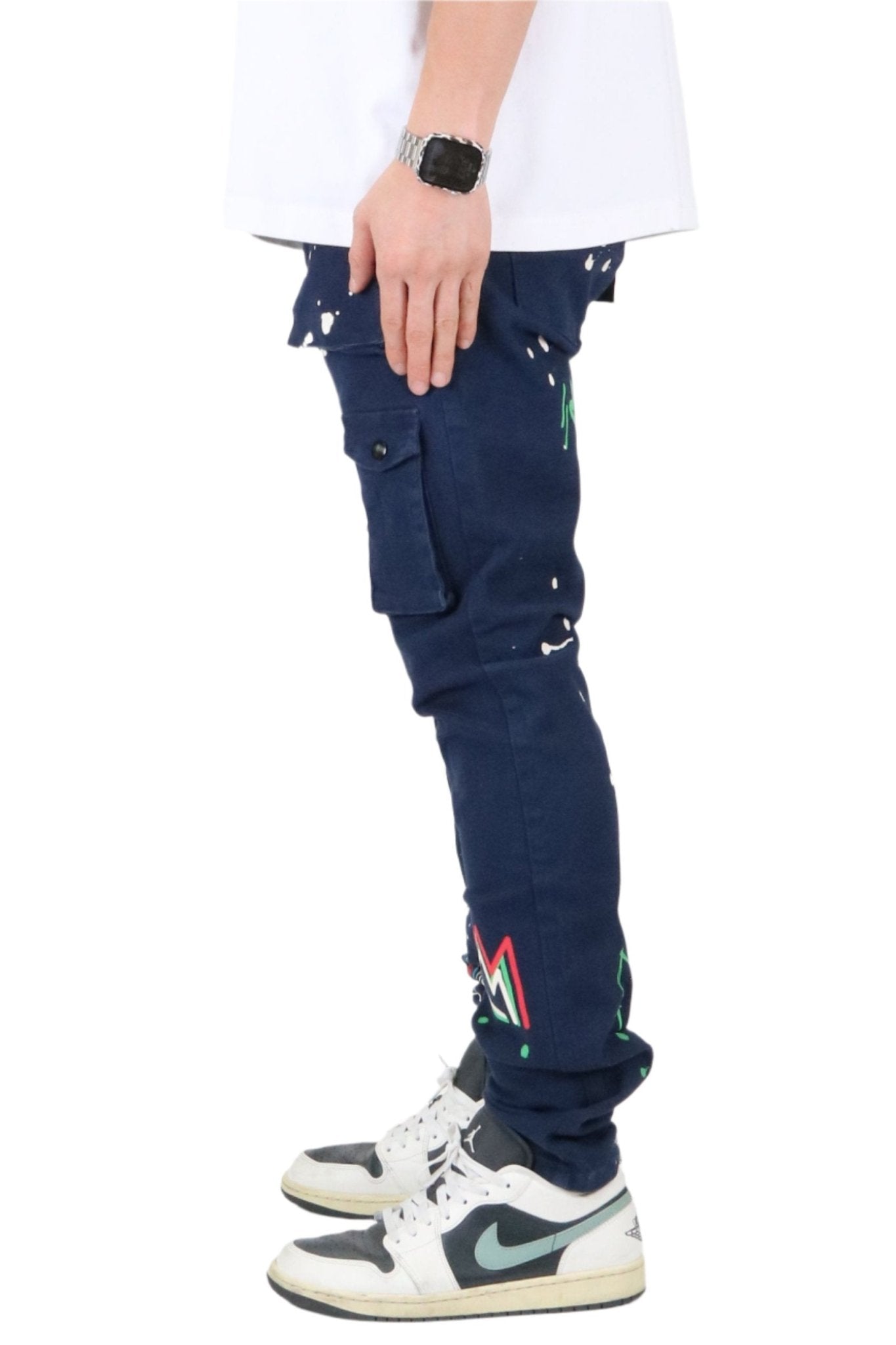 Side view of the blue skinny twill cargo pants showcasing colorful patches.