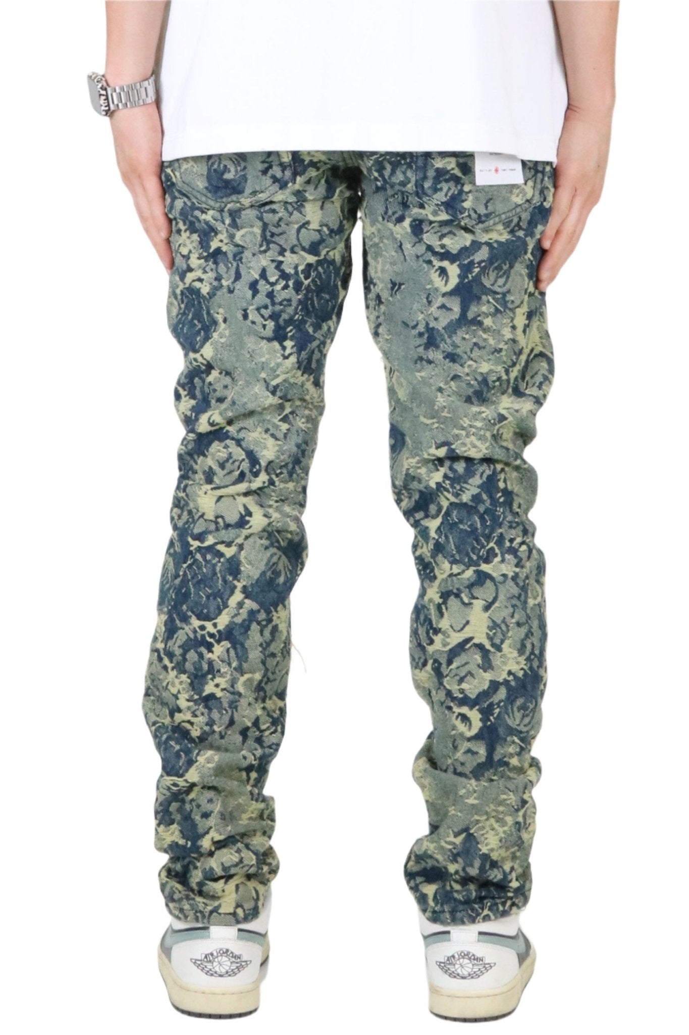 Side view of the green and blue jacquard slim fit denim pants highlighting the fit and design.