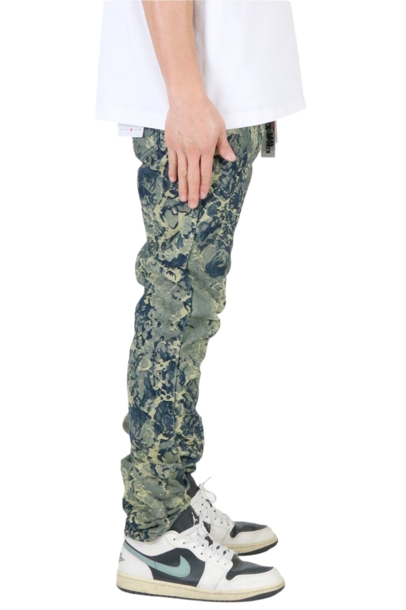 Side view of the green and blue jacquard slim fit denim pants emphasizing the slim fit and pocket details.