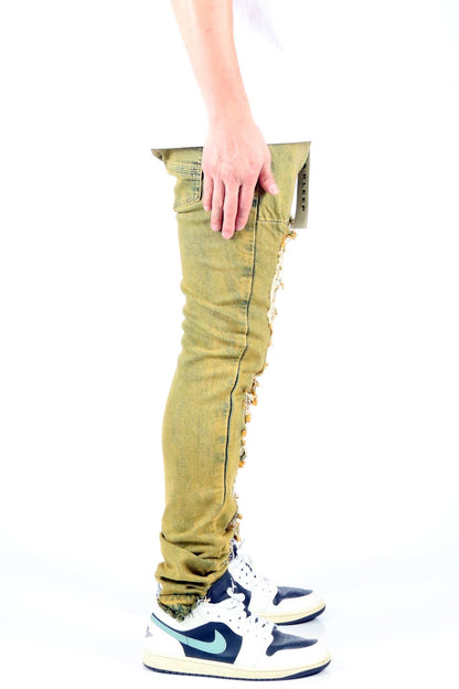 Side view of the vintage olive skinny denim pants emphasizing the slim fit style.