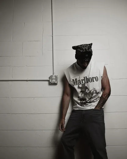 Lifestyle shot of a person in a casual outfit with a graphic t-shirt.