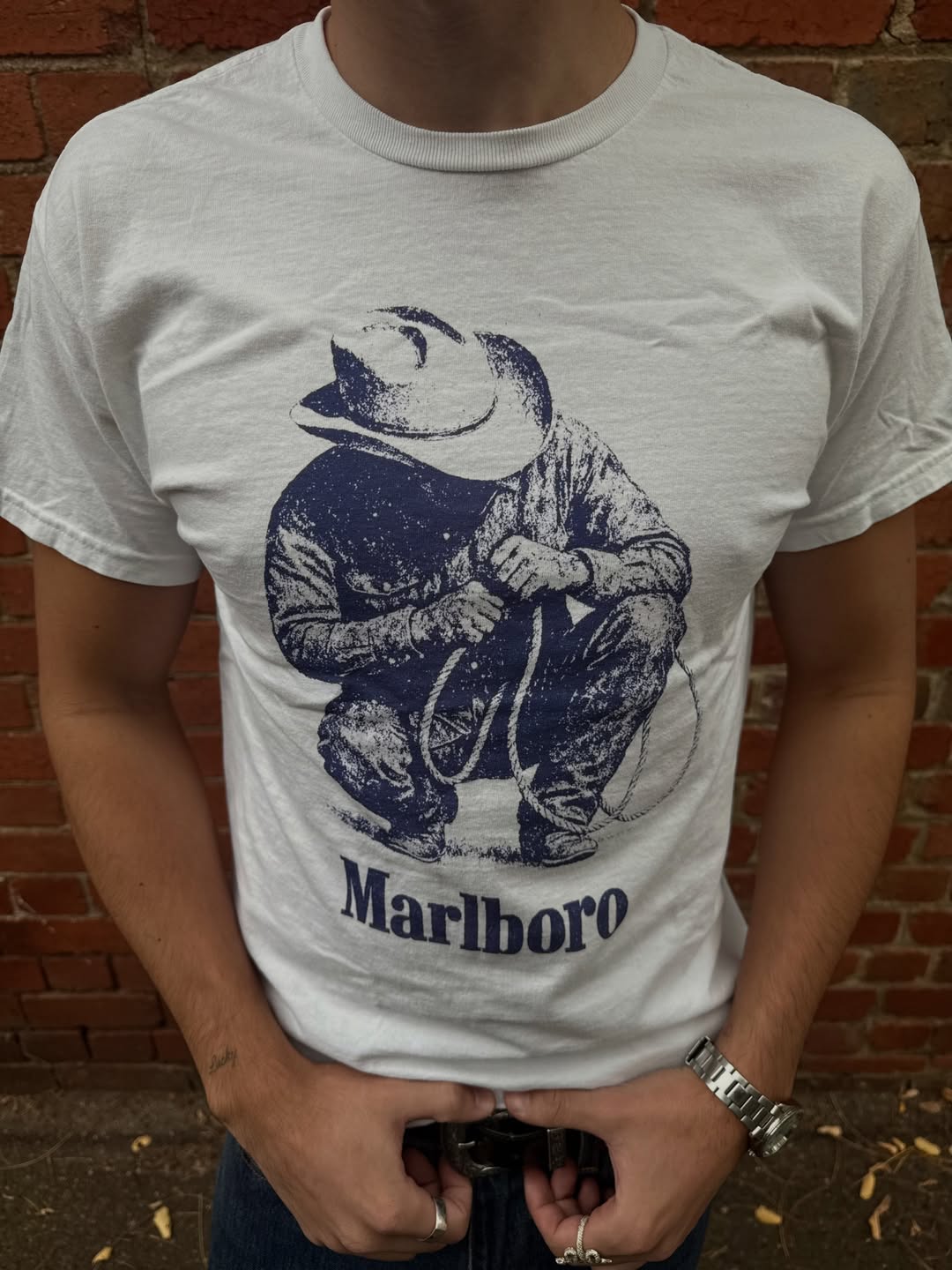 Front view of the graphic white t-shirt with short sleeves.