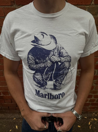Front view of the graphic white t-shirt with short sleeves.