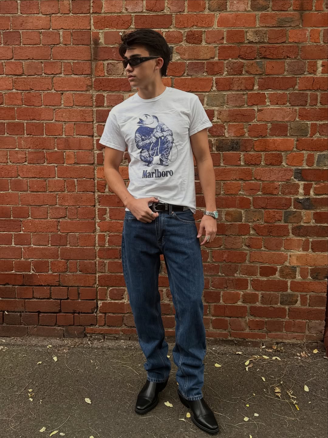 Lifestyle shot of a person posing in a graphic t-shirt.