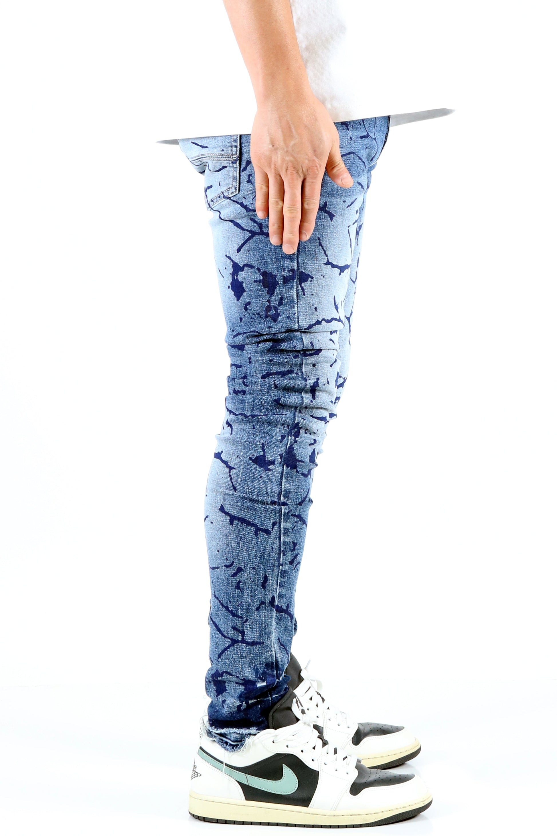 Front view of the blue ripped skinny jeans emphasizing the style.