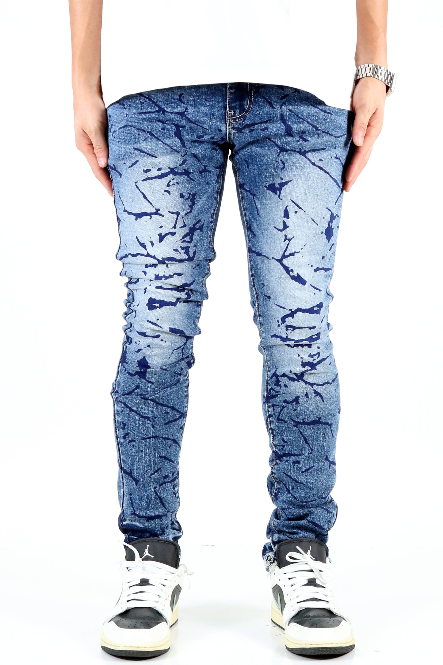 Front view of the blue ripped skinny jeans with a unique design.