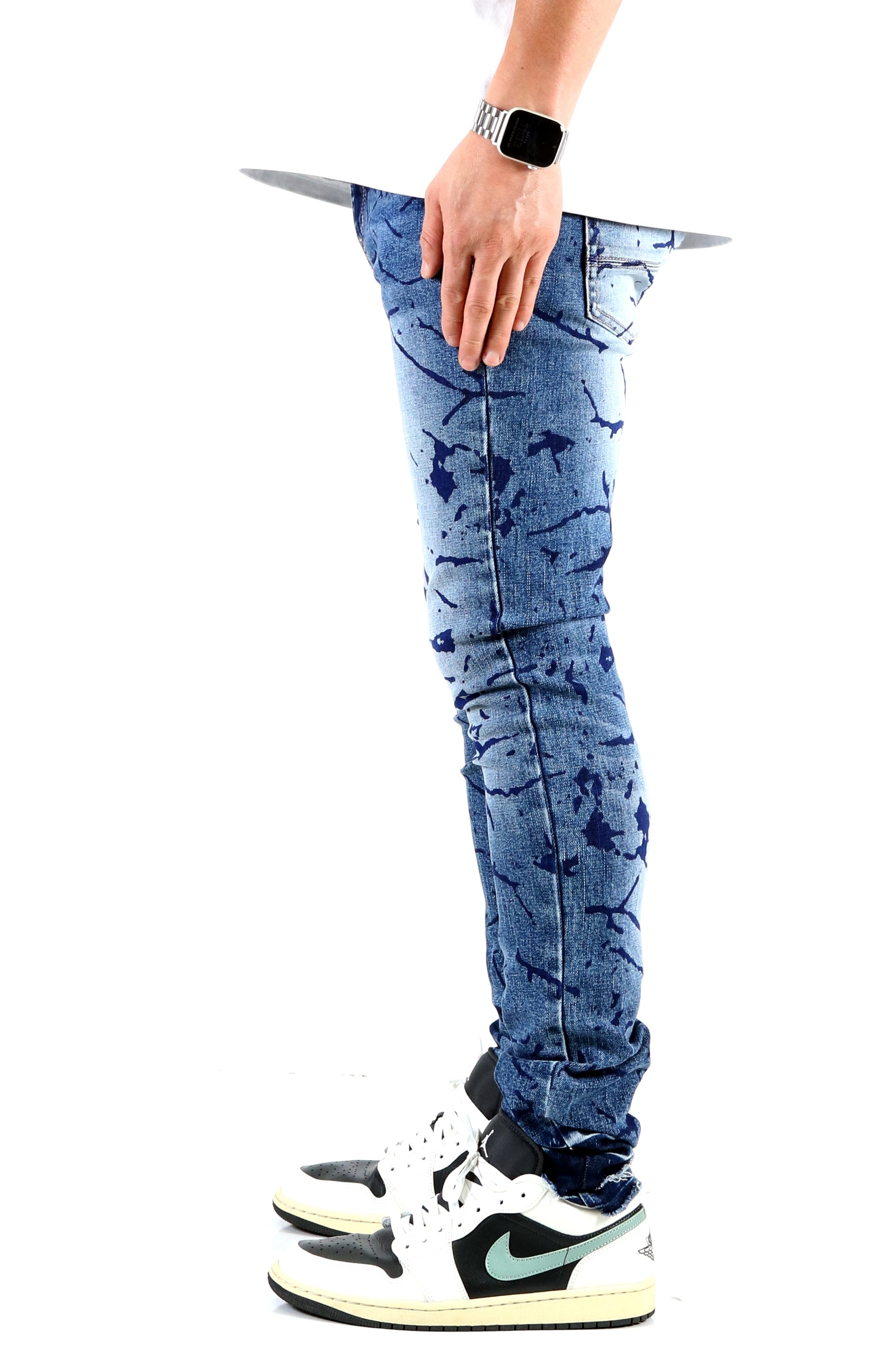 Side view of the blue ripped skinny jeans showcasing the fit.