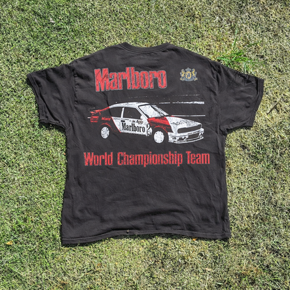Back view of a black t-shirt featuring graphic design and text print.